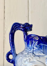 Load image into Gallery viewer, Blue graduated Neptune 'mask' jug with fish handle