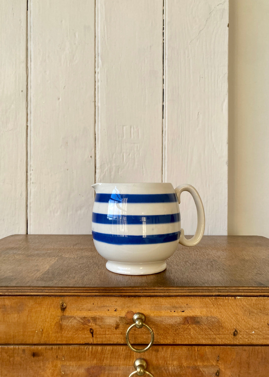 Blue and white striped jug