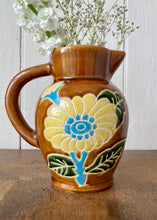 Load image into Gallery viewer, Amber jug with scraffito floral decoration
