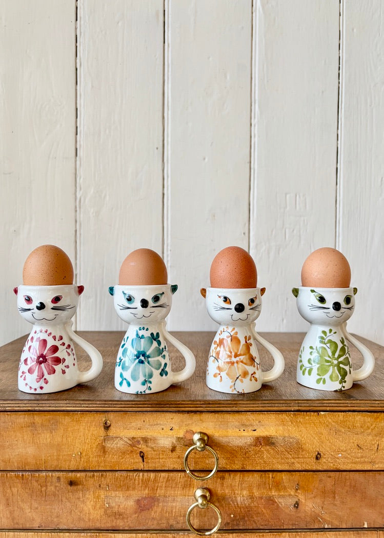 A set of four Portuguese cat egg cups