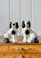 Load image into Gallery viewer, A pair of small black and white Beswick King Charles Spaniel mantle dogs
