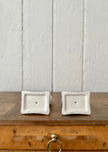 Load image into Gallery viewer, A pair of china cats on blue cushions
