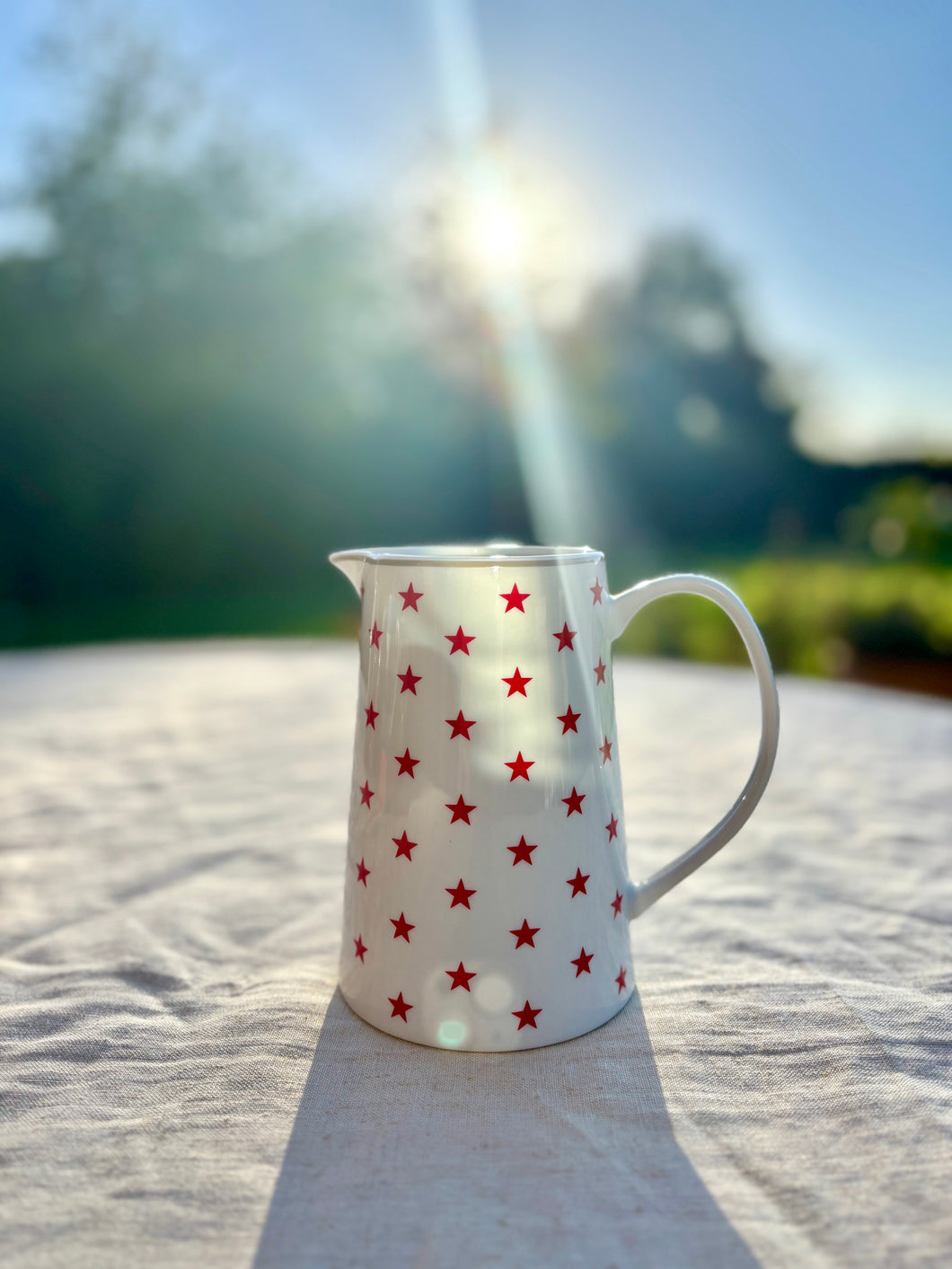 Red stars on white jug