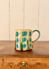 Load image into Gallery viewer, Studio potter mug with stylised floral design
