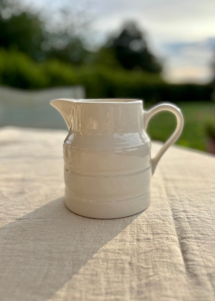 A medium Nelson Ware white banded jug