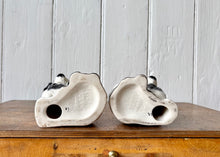 Load image into Gallery viewer, A pair of small black and white Beswick King Charles Spaniel mantle dogs
