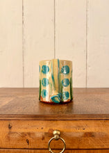 Load image into Gallery viewer, Studio potter mug with stylised floral design
