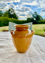 Load image into Gallery viewer, A yellow ochre twin handled glazed vase

