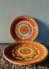 Load image into Gallery viewer, A pair of folk art hand painted terracotta plates
