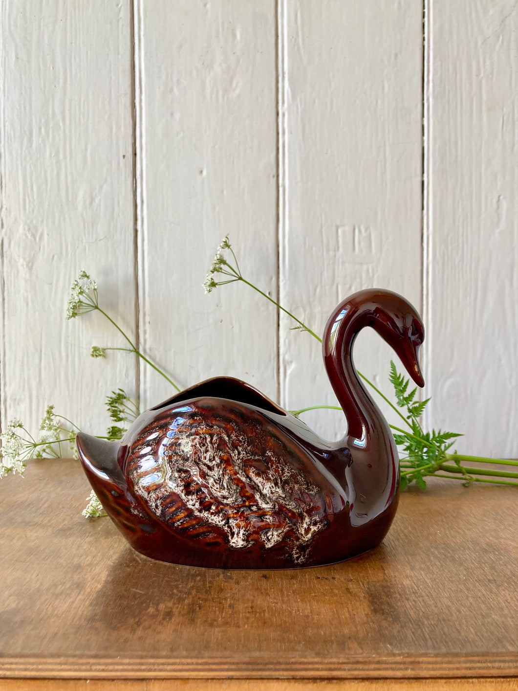 A treacle glaze swan vase by Kernewek Pottery, Cornwall.