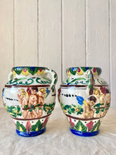 Load image into Gallery viewer, A pair of Italian putti vase with double handles
