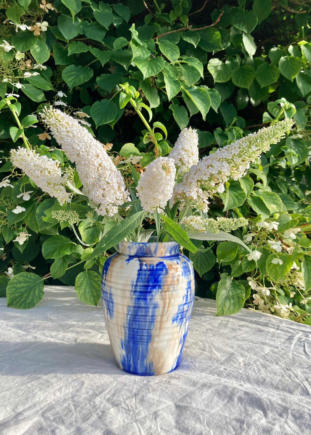 A fabulous hand thrown drip glaze vase