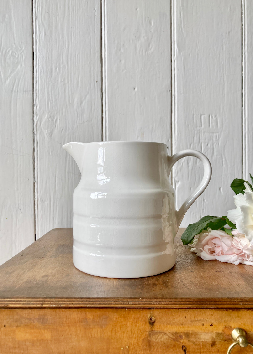 A medium Nelson Ware white banded jug