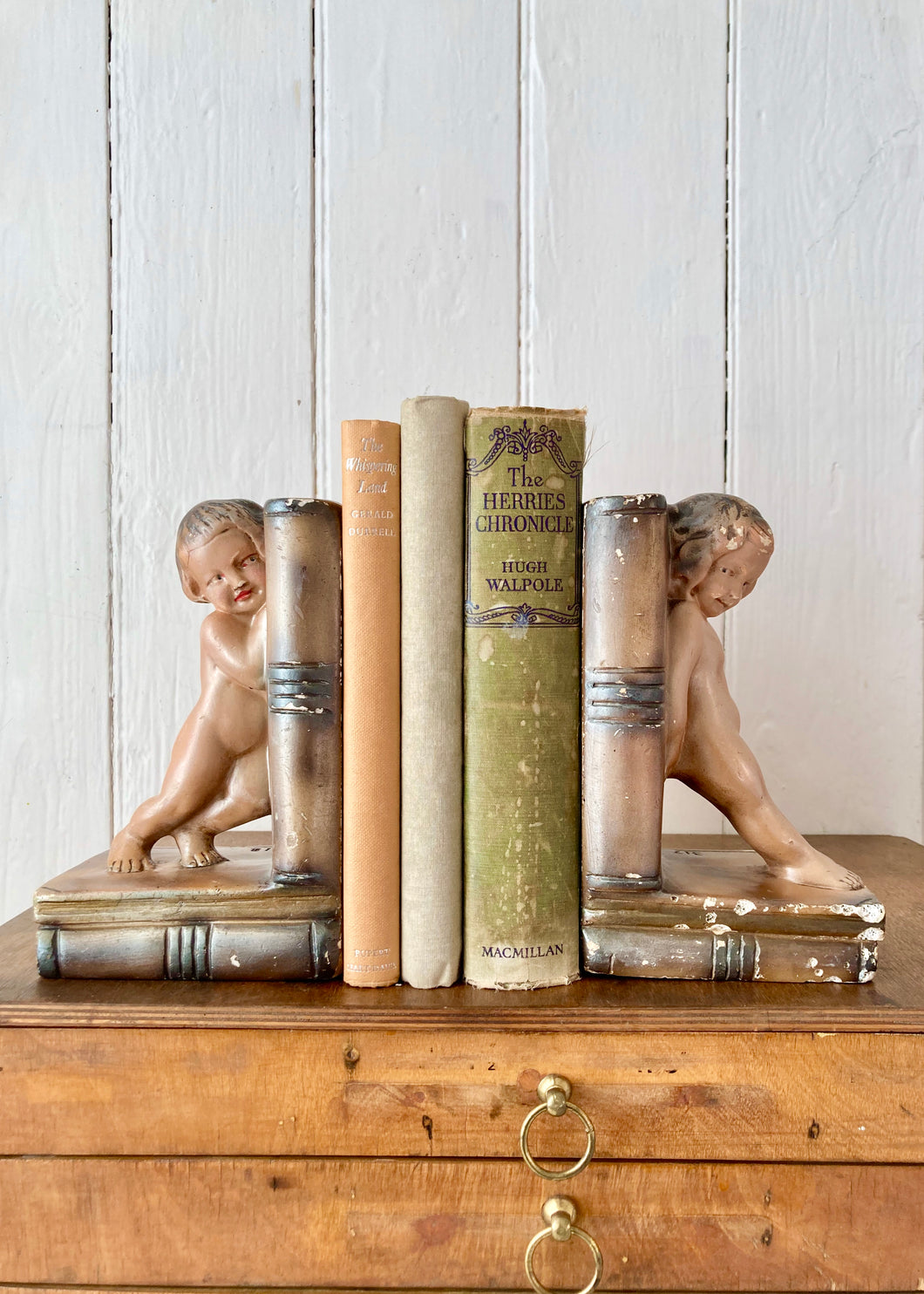 A rare pair of bronzed plaster bookends