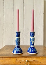 Load image into Gallery viewer, A pair of blue and white oriental-style ceramic candlesticks
