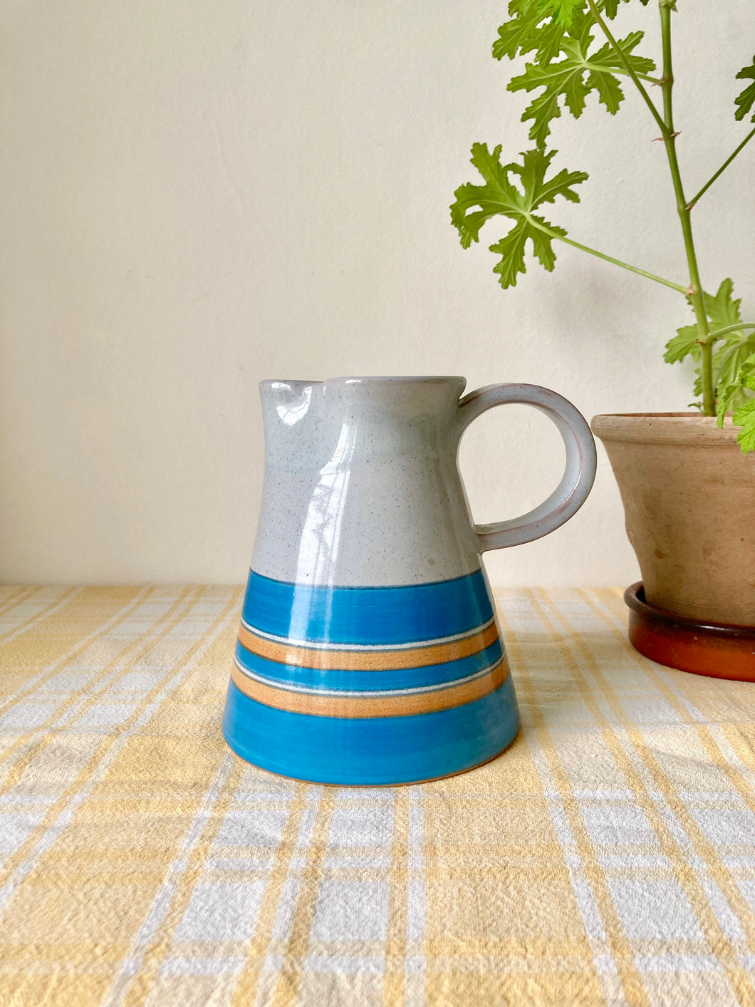 Pale blue and turquoise studio pottery jug