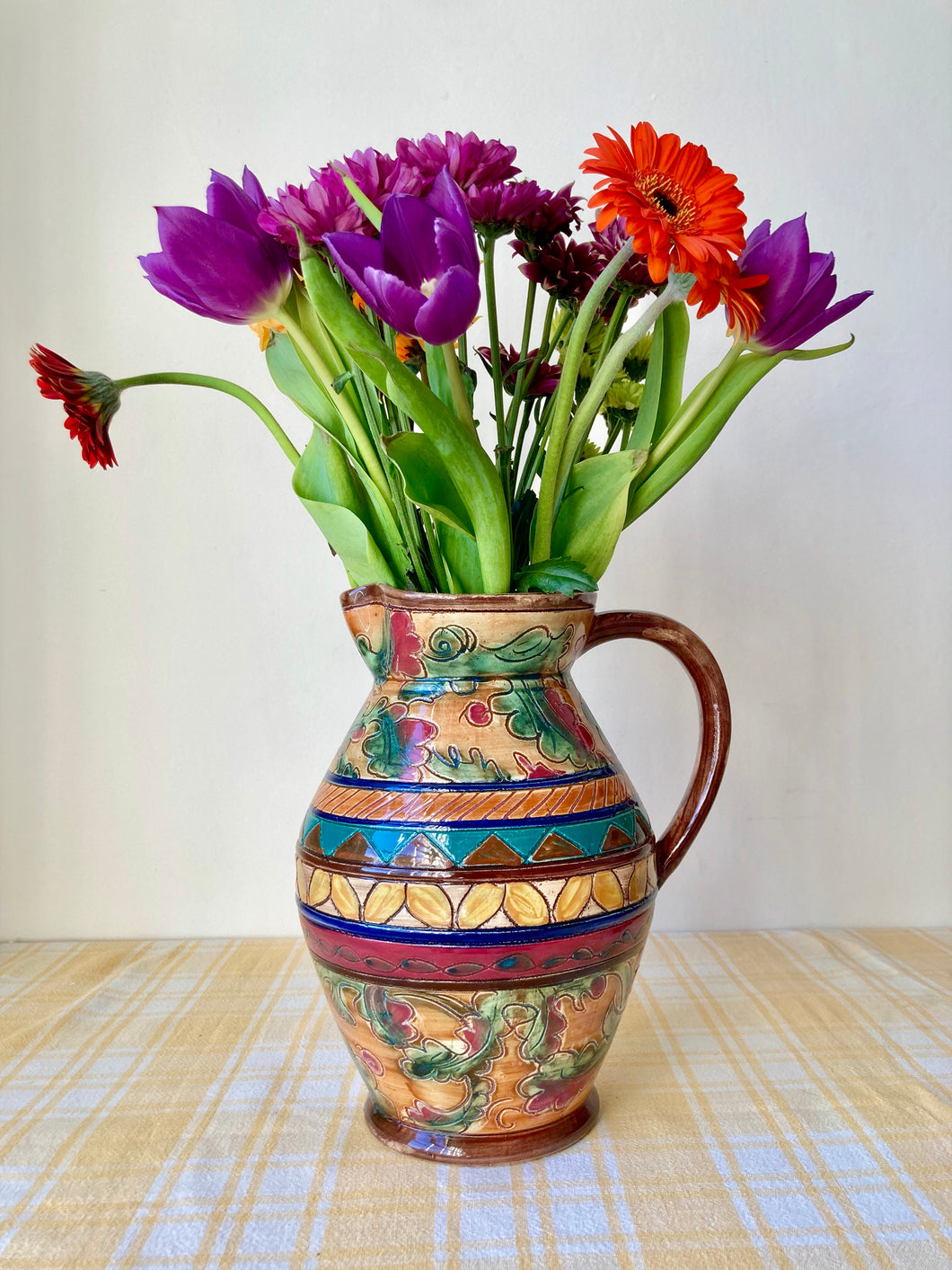 Antique hand thrown and decorated jug