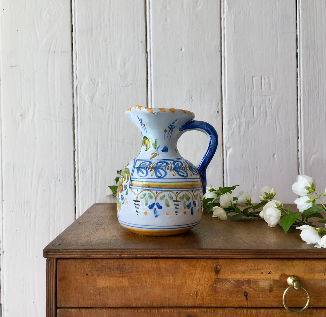 A pretty hand painted floral jug