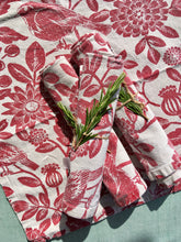 Load image into Gallery viewer, A set of four red on white printed floral napkins with plants and birds
