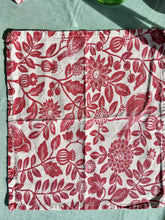 Load image into Gallery viewer, A set of four red on white printed floral napkins with plants and birds
