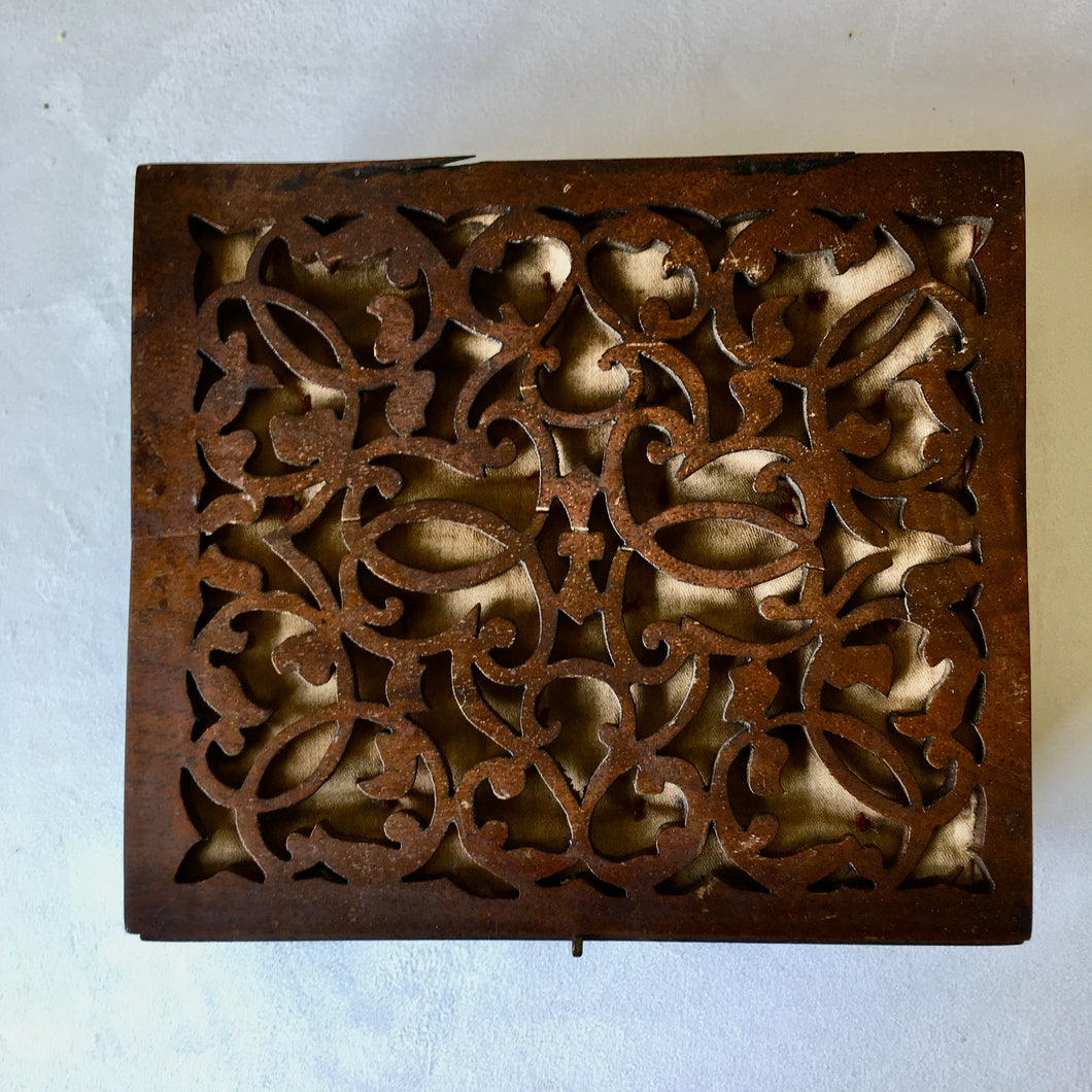 Elaborate decorative wooden fretwork box with padded lining