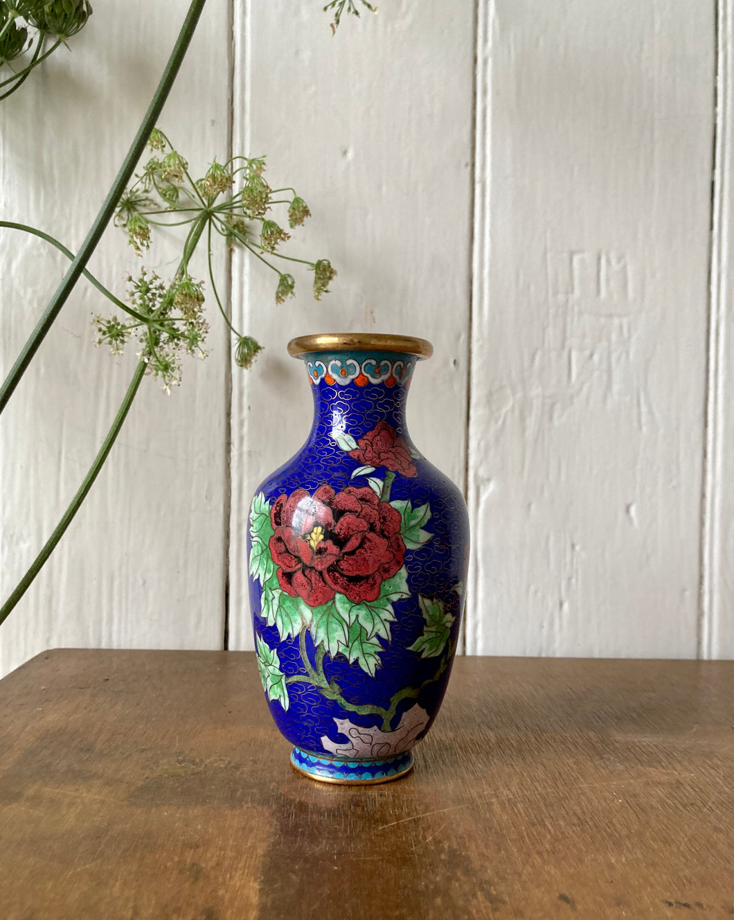 Decorative cloisonné vase in blue with peonies and butterfly