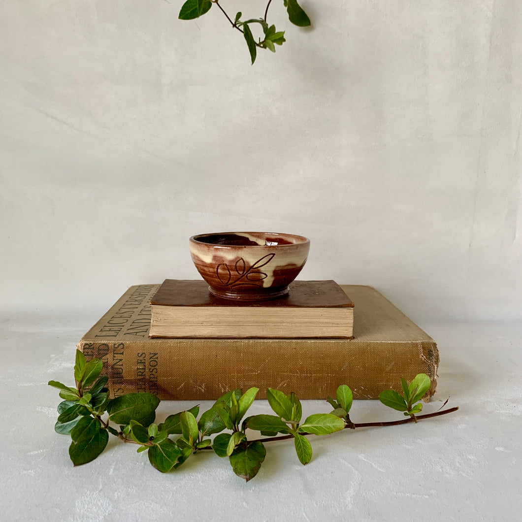 Small brown bowl with leaf decoration