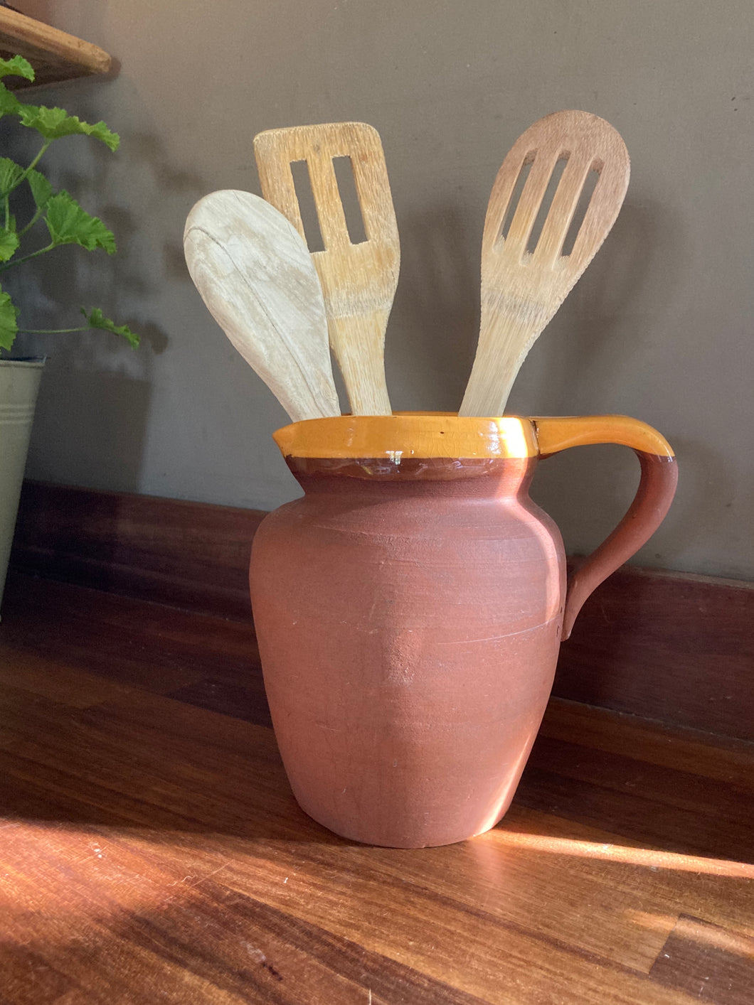 Vintage terracotta jug with yellow slip glazed rim/handle