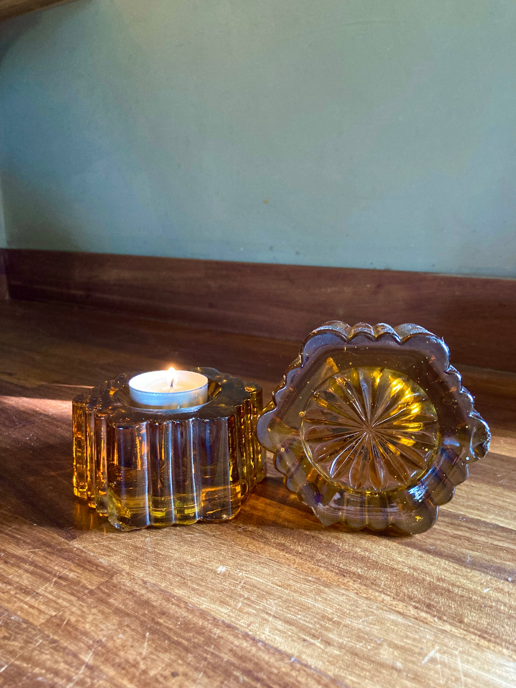 Pair of antique amber glass fluted tea light holders