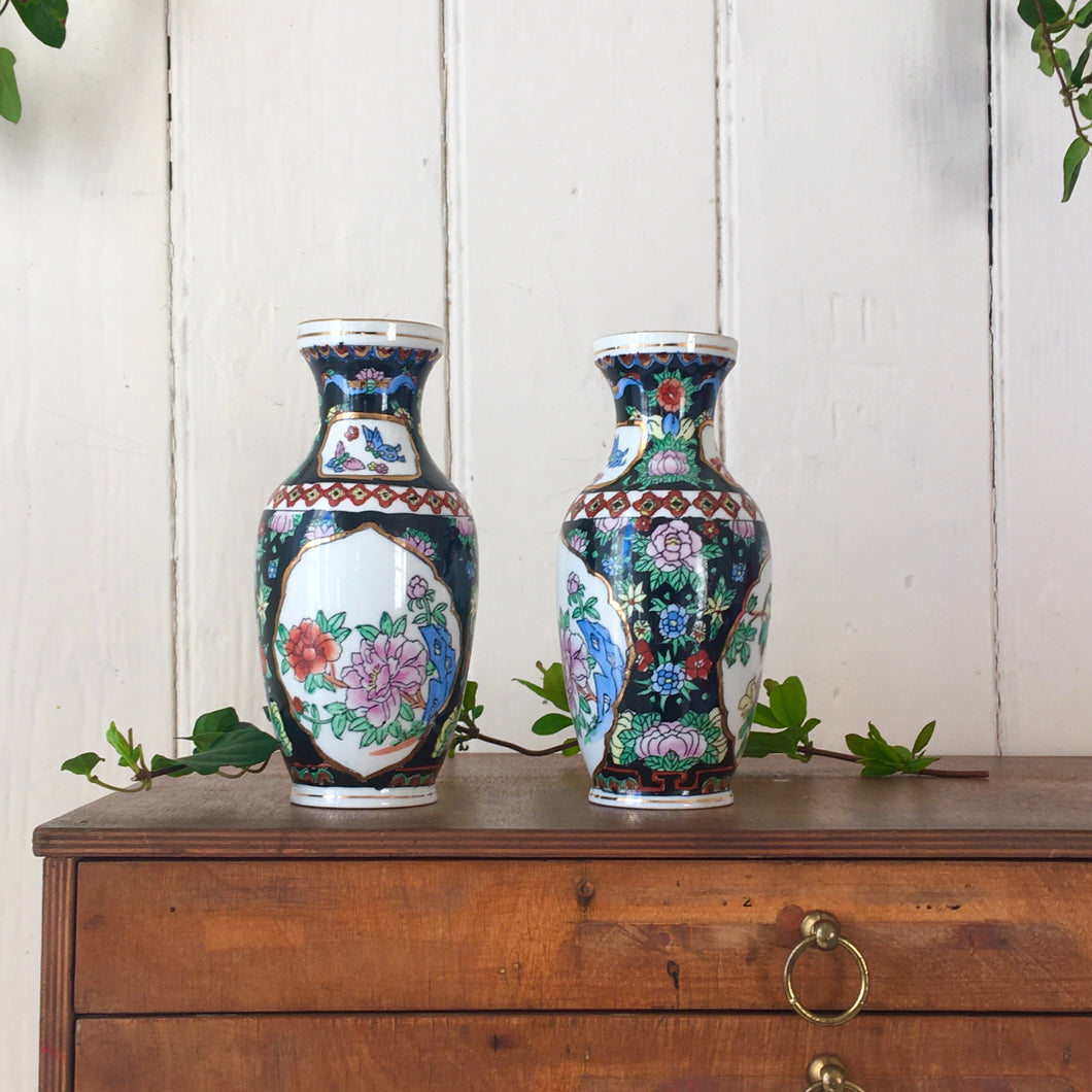 A pair of hand painted Chinese vases