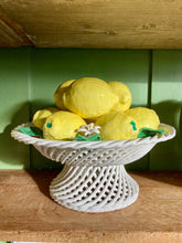 Load image into Gallery viewer, Pierced lattice basket-style pedestal dish full of majolica lemons

