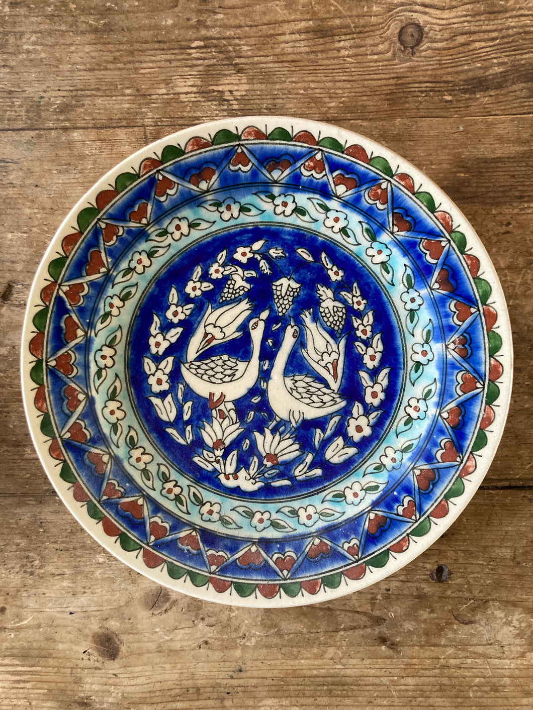Hand painted plate with geese and tulips from Kutahya, Turkey