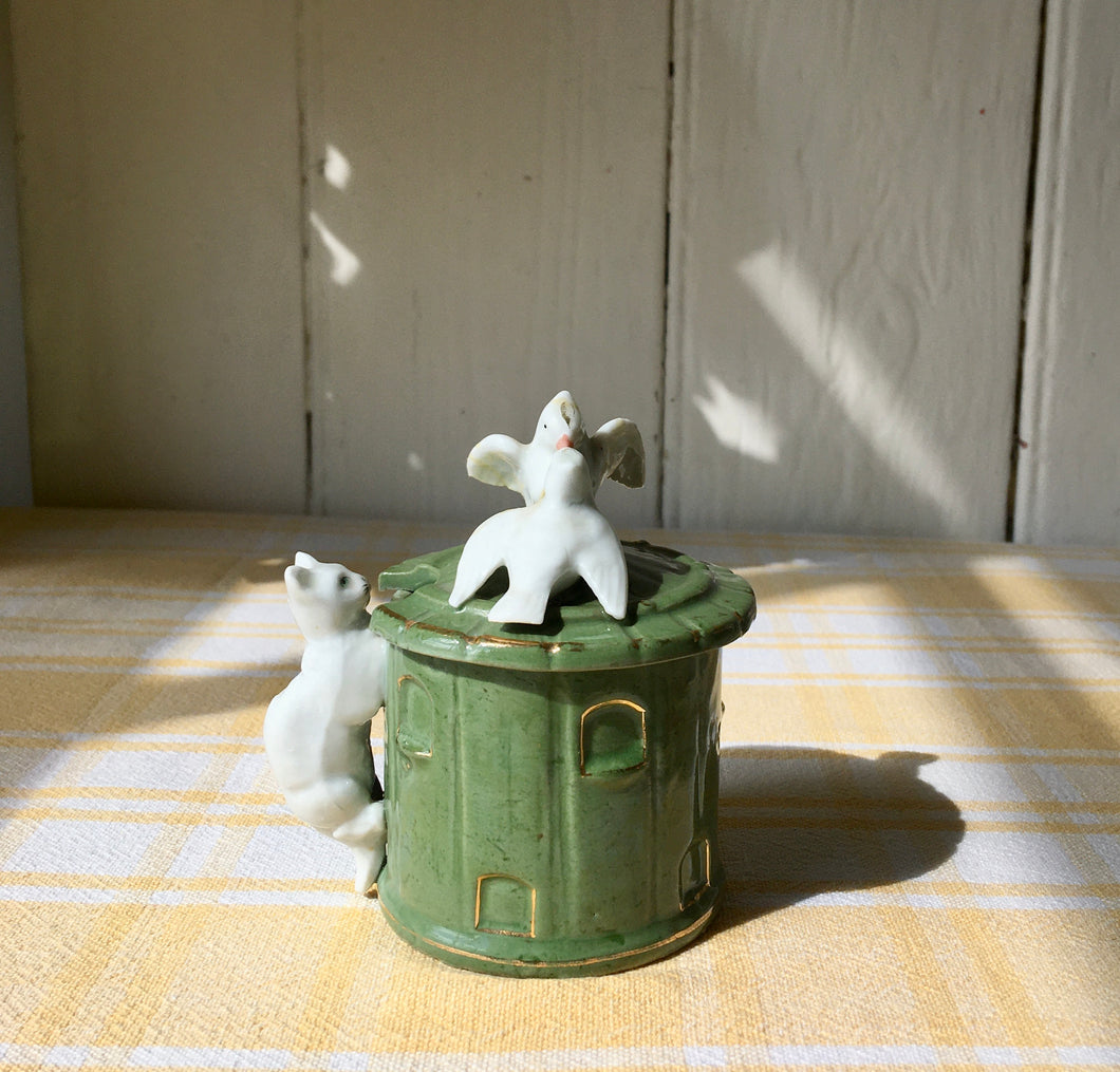 Green trinket pot in the form of a dovecote with doves and cat
