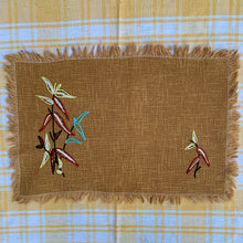 Load image into Gallery viewer, Hand embroidered, folk art style linen placemat with fringed edge.
