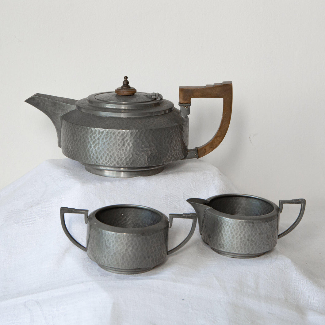 Unity Pewter - English Make tea pot hammered finish and pale brown Bakerlite handle and lid top. Hinged lid. Very smart with minor wear.  Matching milk jug and sugar bowl - The Vintage Pieces