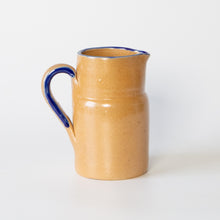 Load image into Gallery viewer, Rustic stoneware jug with blue rim/handle
